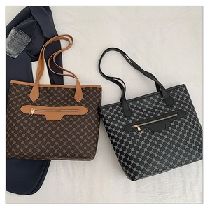 Detailed flat lay of vintage printed tote bags in brown and black with geometric patterns