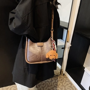 Vintage dark brown large capacity crossbody bag with a cute plush teddy bear charm