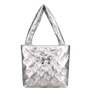 Silver quilted tote bag with bow embroidery and metallic finish in Y2K puff style