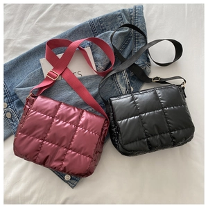 Quilted nylon crossbody bags in burgundy and black with plush square pattern detail