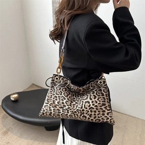 Winter leopard print tote bag with amber acrylic chain strap and soft leather finish