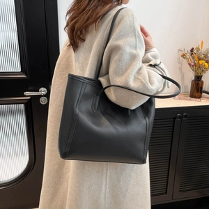 Classic black leather tote bag with long straps for women's elegant daily commute