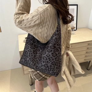 Fashionable leopard print hobo shoulder bag with large capacity shown on model