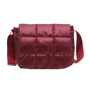 Deep red quilted puffer crossbody bag with grid stitching and adjustable shoulder strap