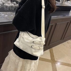 Minimalist white glossy PU leather shoulder bag with decorative buckles and silver hardware