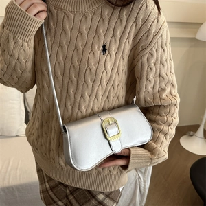 Vintage silver minimalist shoulder bag with a large gold buckle for women in winter fashion