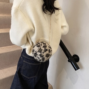 Furry leopard print sphere handbag with gold chain strap and crystal round handle