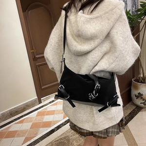 Chic black motorcycle style baguette bag with silver buckles and large capacity strap