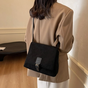 Retro matte black crossbody bag with flap cover and buckle strap for daily commute