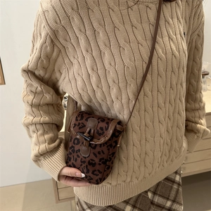 Fashionable leopard print faux suede crossbody phone bag with brown leather trim and buckle