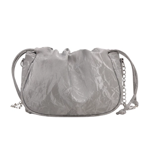 Silver pleated pouch bag with stylish metal chain strap for modern minimalist women