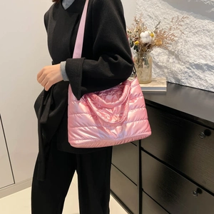 Pink metallic quilted space cotton tote bag worn with a casual winter outfit