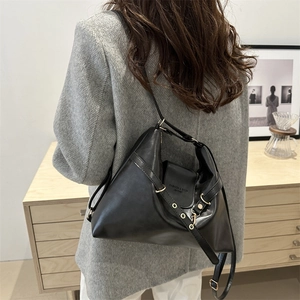 Vintage black soft leather oversized backpack and hobo bag with gold hardware detail