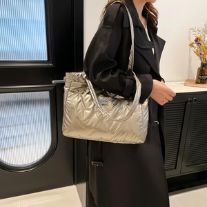 Quilted champagne gold down puffer tote bag with large capacity and stylish metallic finish
