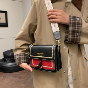 Chic black and red small crossbody bag with floral jacquard wide strap and golden hardware