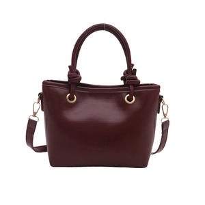 Minimalist burgundy bucket bag with round metal buckle and knotted handle for women