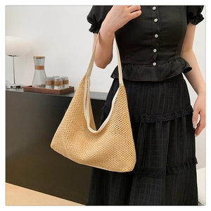 French style woven straw tote bag shown on shoulder with high capacity hobo design