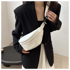 Detailed view of a white PU leather moon bag with adjustable strap and buckle closure