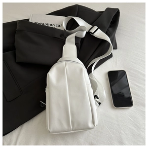 White minimalist crossbody chest bag with structured synthetic leather and nylon strap