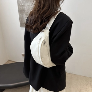 White minimalist faux leather waist bag with dual metal zippers for women casual style