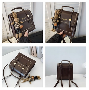 Detail of dark brown PU leather backpack with gold rivets and cute bunny charm