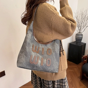 Vintage wash grey canvas tote bag with brown leather letters and shoulder strap