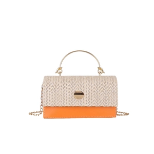 Chic woven patchwork handbag with orange leather base and gold metal chain strap