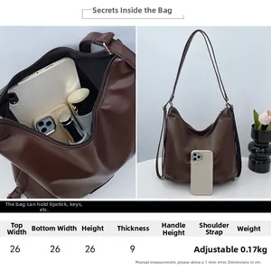Detailed size chart for large capacity brown PU tote bag with adjustable shoulder strap