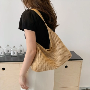 Large capacity woven straw tote bag in light khaki, perfect for summer vacation and daily use