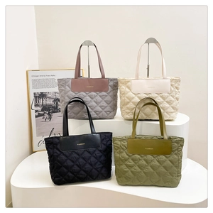 Quilted tote bags in grey, beige, black, and olive green with elegant fashion engraving
