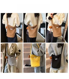 Winter faux fur bucket bag with cute bear charm shown in four stylish colors on model