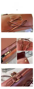 Detail view of brown leather backpack featuring bow tie, metal zippers and magnetic buckle