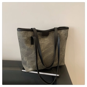 Close-up of vintage canvas texture with FASHION BAGS leather label and black trim