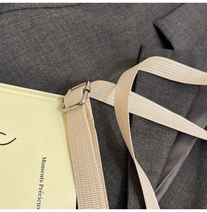 Macro detail of high-density nylon woven strap with silver adjustable buckle closure