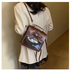 Brown vintage PU leather shoulder bag featuring a clear PVC window and cross-tie detail