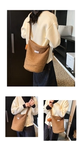Close-up of brown sherpa bucket bag with plush bear charm and love fashion patch