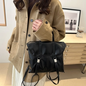 British vintage black faux leather backpack with silver buckles and flap closure for women