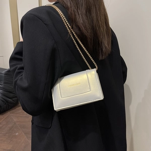 Elegant white pearlescent chain flap bag for women featuring gold fashion lettering
