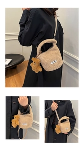 Detail of plush lamb wool bucket bag with CLEARVK label and cute bear charm