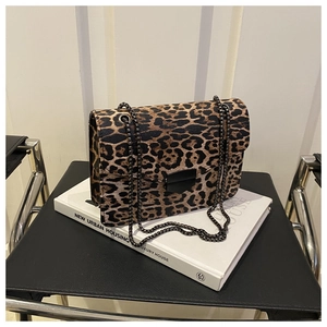 Close-up of leopard print shoulder bag with metallic chain and black square press lock