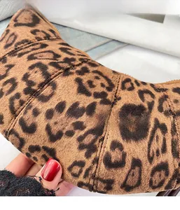 Close-up of lightweight leopard print croissant bag showing soft suede texture and zipper
