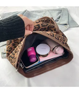Detail view of leopard print tote bag interior with large capacity and zip closure