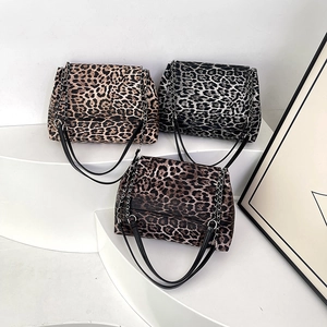 Chic leopard print shoulder bag with metal chain strap in brown and grey animal patterns