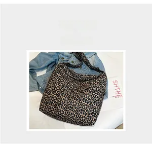 Detailed view of leopard print canvas tote bag with durable texture and pattern