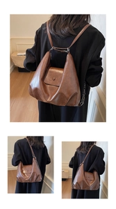 Detail view of large brown vintage tote bag showing backpack and shoulder carry styles