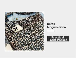Detailed macro view of the practical front pocket on a leopard print canvas tote bag