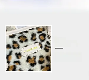 Detailed close-up of leopard print faux fur texture with gold fashion bag leather label