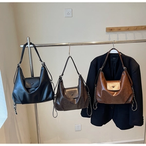 Three vintage leather tote bags in black, dark coffee, and brown red with chain detail