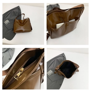 Macro details of dark brown oil-wax tote bag showing zipper and spacious interior