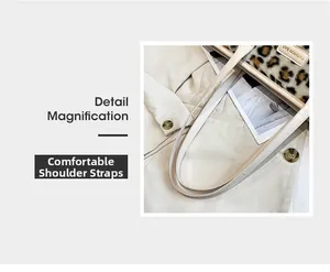 Detail magnification of the leopard faux fur tote featuring a cream leather shoulder strap